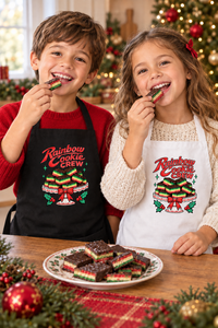 Boy in a red shirt and girl enjoying rainbow cookies at Christmas