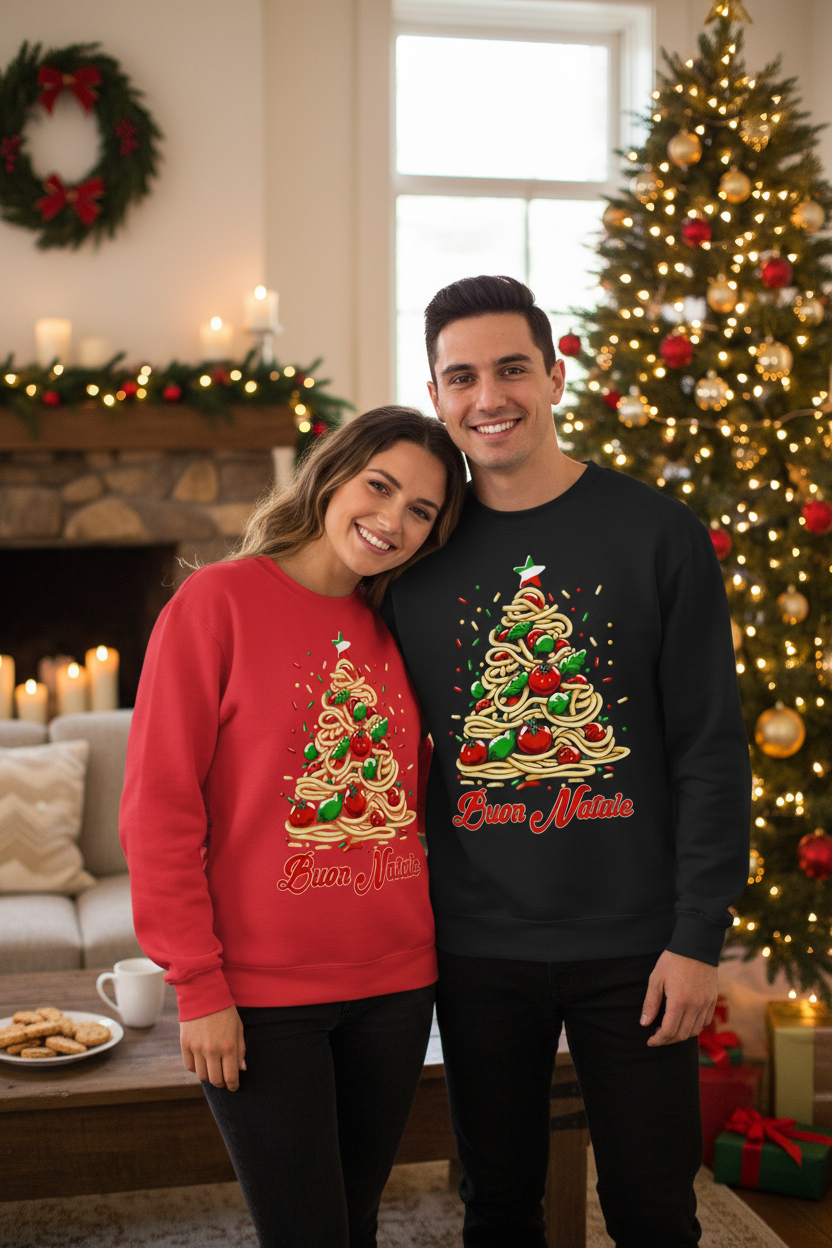 A man and a woman standing together in a cozy living room, wearing matching Christmas sweatshirts. The woman wears a red sweatshirt with a red-and-green Christmas tree graphic and the text 'Bring It Home'.