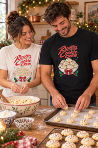 Couple making ricotta cookies, man in black tee and woman in sand tee