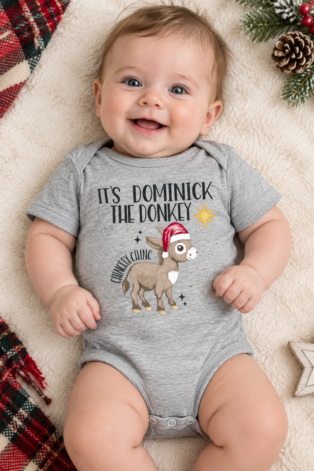 Infant in heather gray onesie with Dominick the Donkey logo