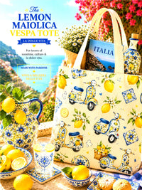 Tote bag with Vespa and majolica lemon design, surrounded by lemons and a pitcher, with scenic background.