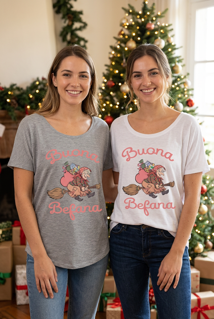 Two young women wearing gray and white Buona Befana slouch tops