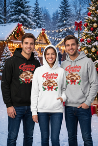 Woman in the white Cuccidati Crew hoodie with two men in black and gray hoodies in a festive snowy Christmas scene