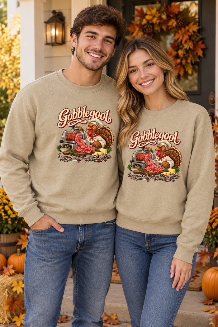 Young couple wearing matching Sand Gobblegool sweatshirts on a Thanksgiving porch