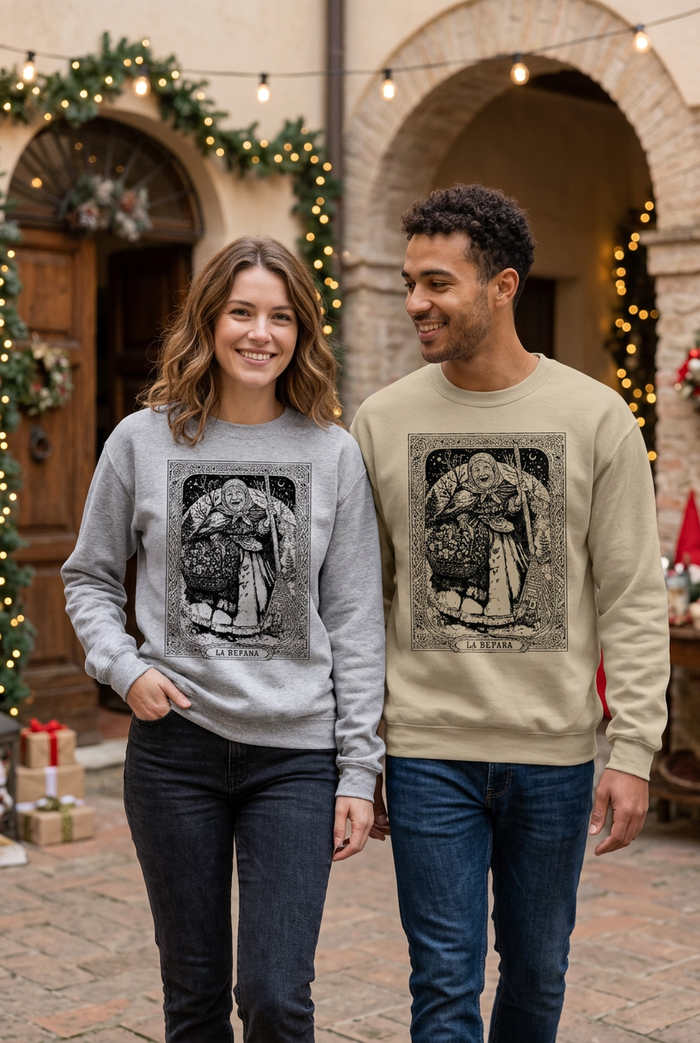 Young couple wearing the gray and sand Befana Storybook sweatshirts